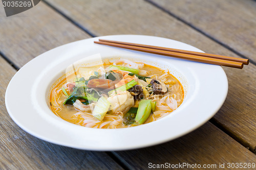 Image of Bowl of traditional Thai tom yam soup