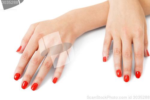 Image of Woman with beautiful manicured red fingernails