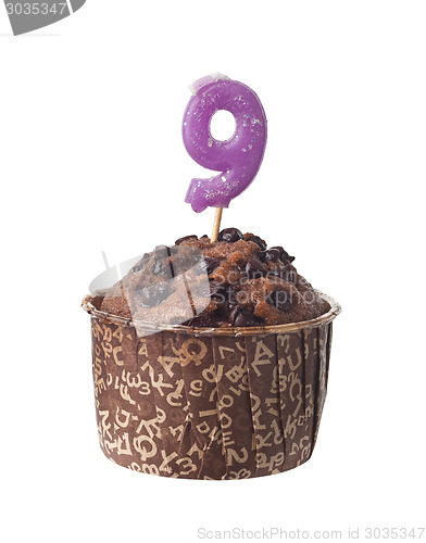 Image of Chocolate muffin with birthday candle for nine year old