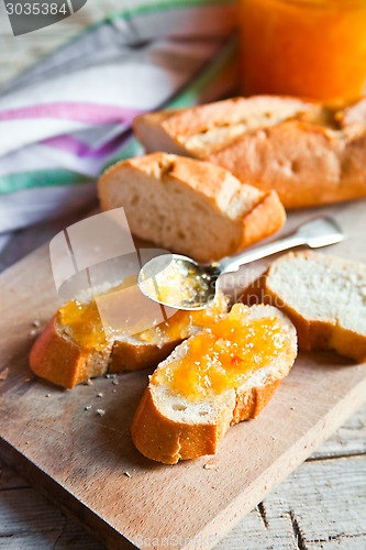 Image of pieces of baguette with orange marmalade