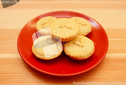 Image of Christmas mince pies served on a red plate