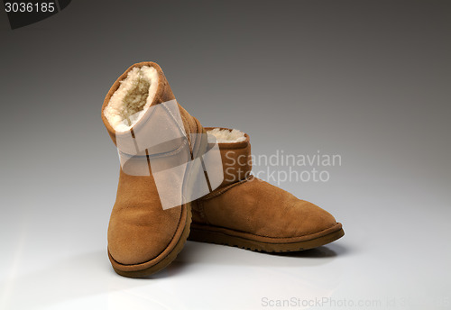 Image of pair of beige uggs with light fur