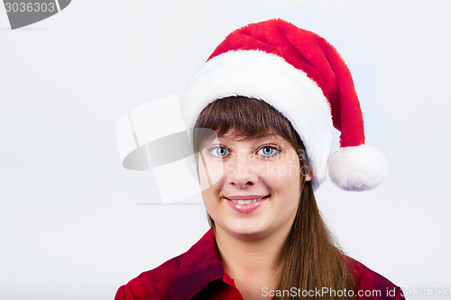 Image of blue-eyed beautiful girl in santa hat