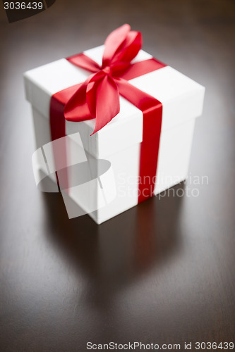 Image of White Gift Box with Red Ribbon and Bow