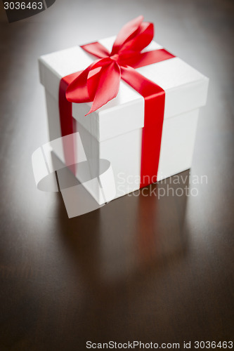 Image of White Gift Box with Red Ribbon and Bow