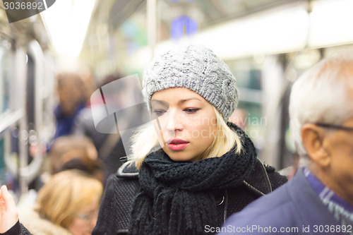 Image of Woman on subway.