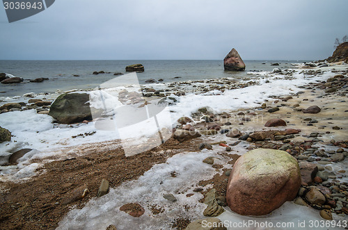 Image of Baltic Sea coast in winter cloudy weather  