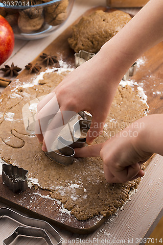 Image of Close up little hands making the gingerbread cookies