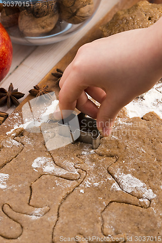 Image of Close up little hands making the gingerbread cookies