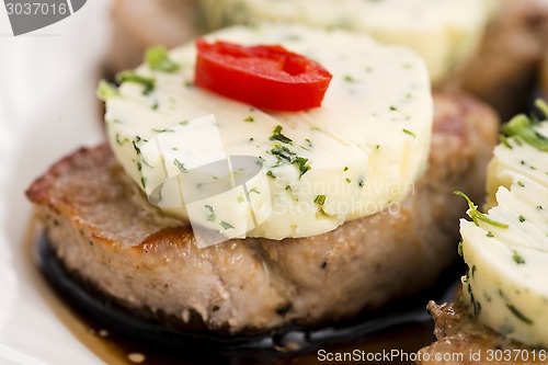 Image of steak with herbs butter