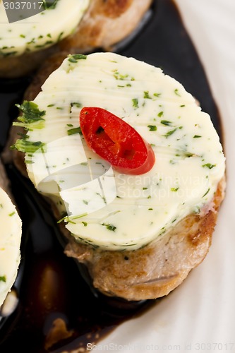 Image of steak with herbs butter