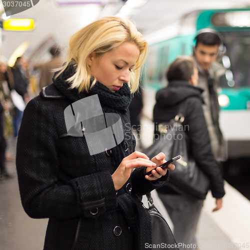 Image of Woman on a subway station.