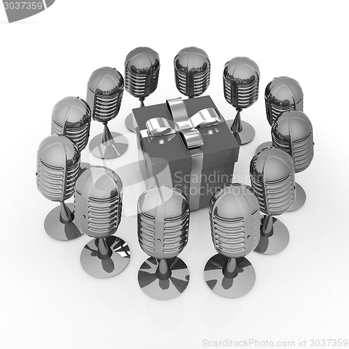 Image of microphones around gift box