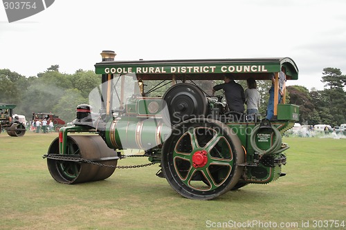 Image of large green traction steam roller