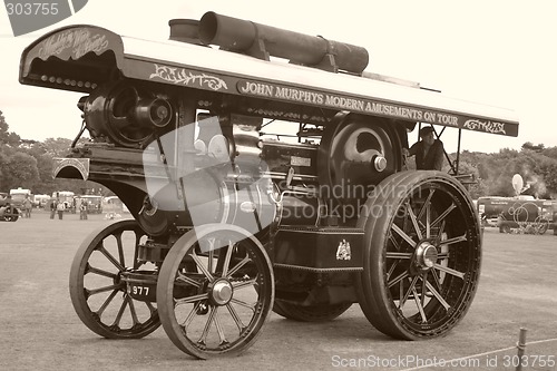 Image of large black traction steam engine