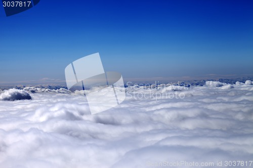 Image of Mountains under clouds in sun day