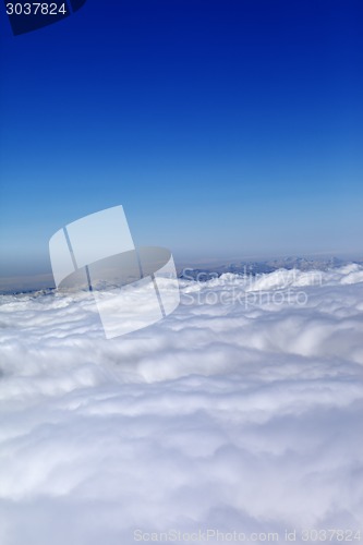 Image of Mountains under clouds in sun day