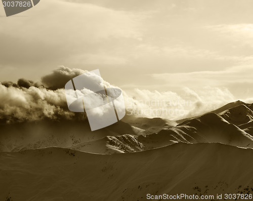 Image of Sepia mountains in haze at sunny evening