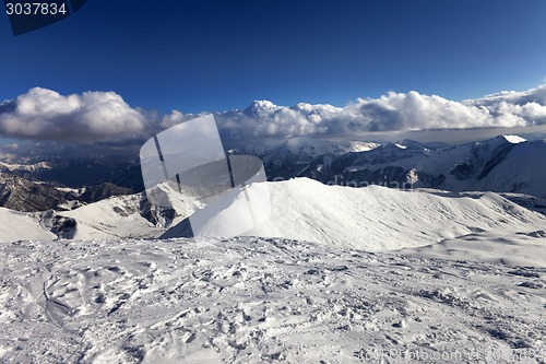 Image of View on off-piste slope and snowy mountains