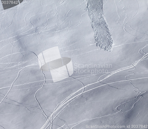 Image of Off-piste slope with traces of skis, snowboarding and avalanche