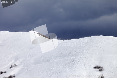 Image of Off-piste slope and overcast gray sky in bad weather day