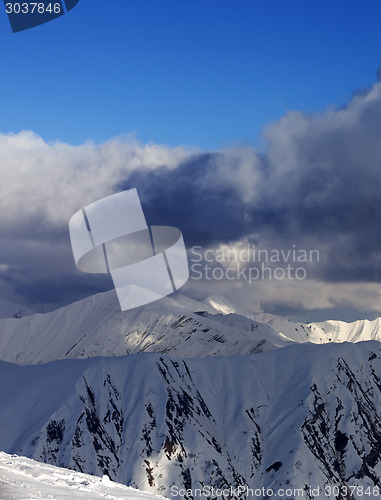 Image of Snow mountains and blue sky with clouds