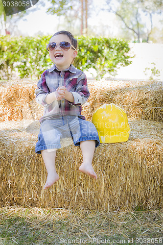 Image of Young Mixed Race Boy Laughing with Sunglasses and Hard Hat