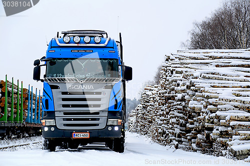 Image of Blue Scania V8 Logging Truck at Snowy Railway Timber Yard