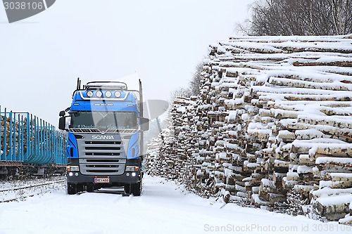 Image of Blue Scania V8 Logging Truck at Snowy Railway Timber Yard