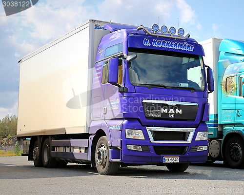 Image of Purple Man Truck on a Yard