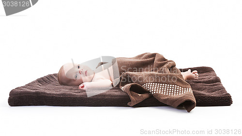 Image of baby boy over brown blanket