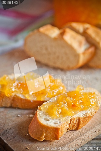 Image of fresh bread with orange jam