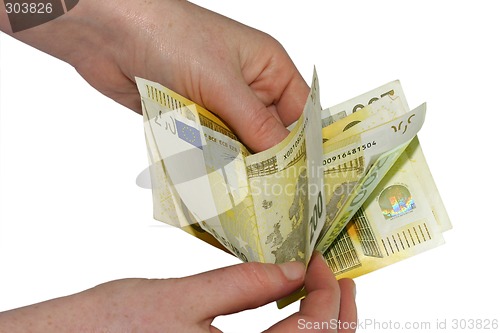 Image of Hand holding euro bills