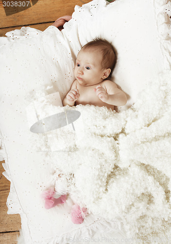 Image of baby with white blanket