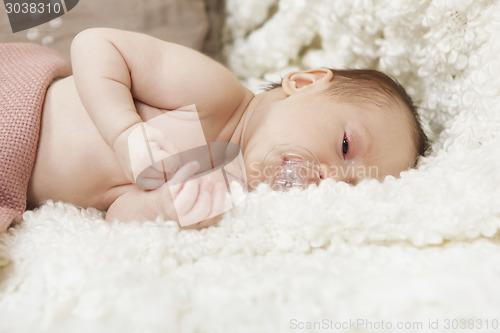 Image of baby with pacifier