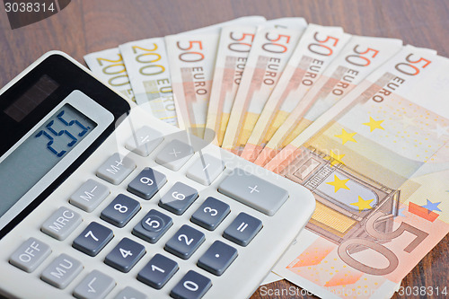 Image of Calculator and banknotes on the table