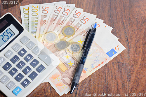 Image of Calculator and money on the table