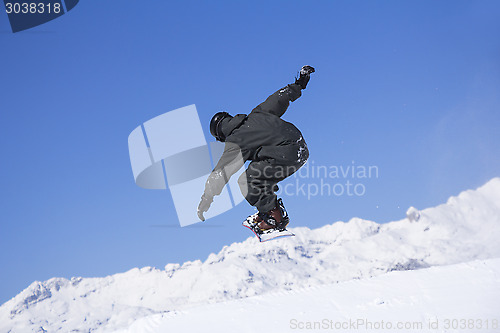 Image of Extreme Snowboarder jumping