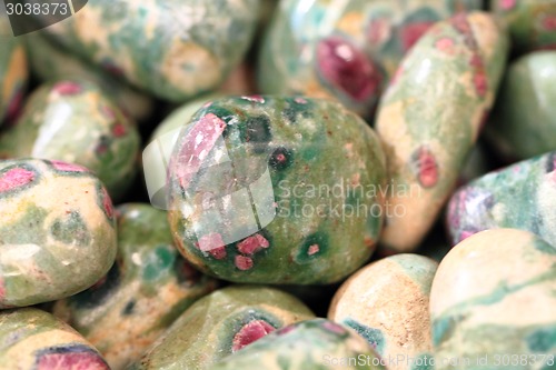 Image of ruby gem in green mineral 