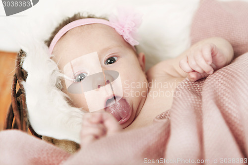 Image of Baby puts out tongue