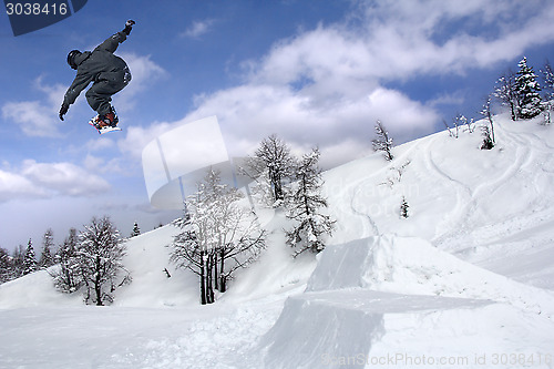 Image of Snowboarder Extreme jumping