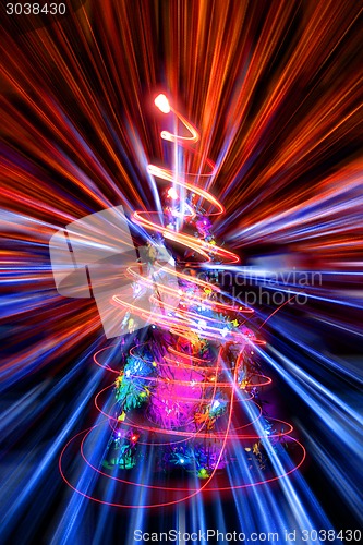 Image of xmas tree with abstract christmas lights explosion