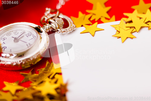 Image of Christmas card. background with a clock and decorations. macro