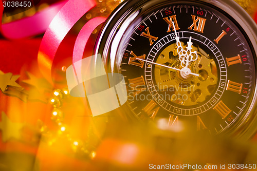 Image of Christmas card. background with a clock and decorations. macro
