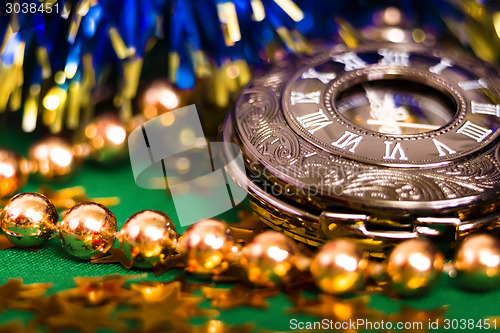 Image of Christmas card. background with a clock and decorations. macro