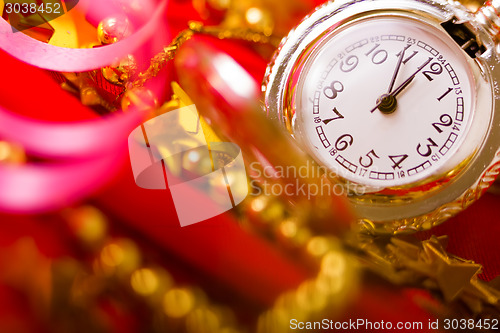 Image of Christmas card. background with a clock and decorations. macro