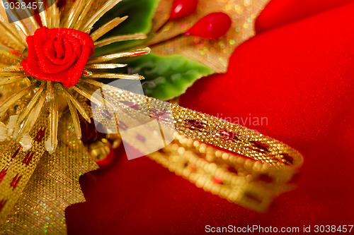 Image of Christmas card. Red cloth with decorations