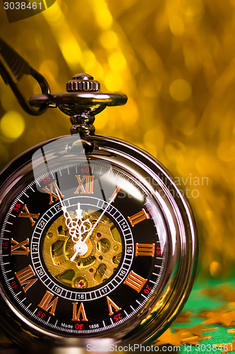 Image of Christmas card. background with a clock and decorations. macro