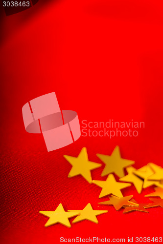 Image of Christmas card. Red cloth with gold stars