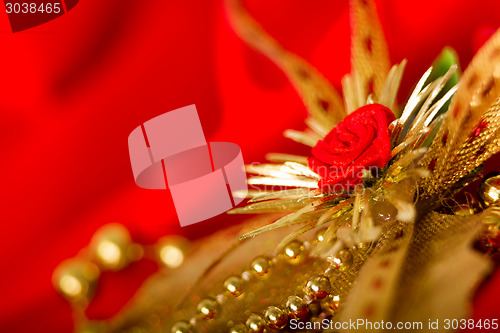 Image of Christmas card. Red cloth with decorations